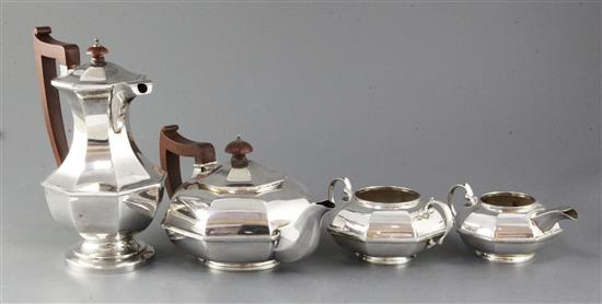 A George V silver three piece octagonal tea set and similar hot water jug, gross 54.5 oz.